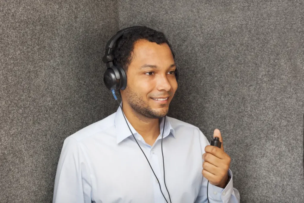 Man having a hearing assessment in a sound proof room