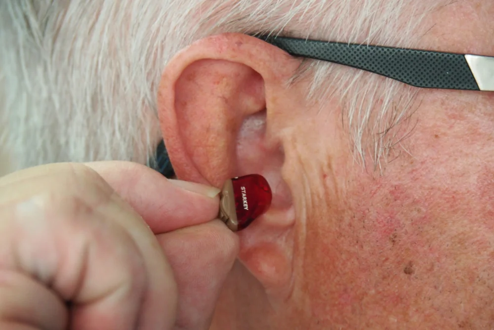 Older man with a hearing aid