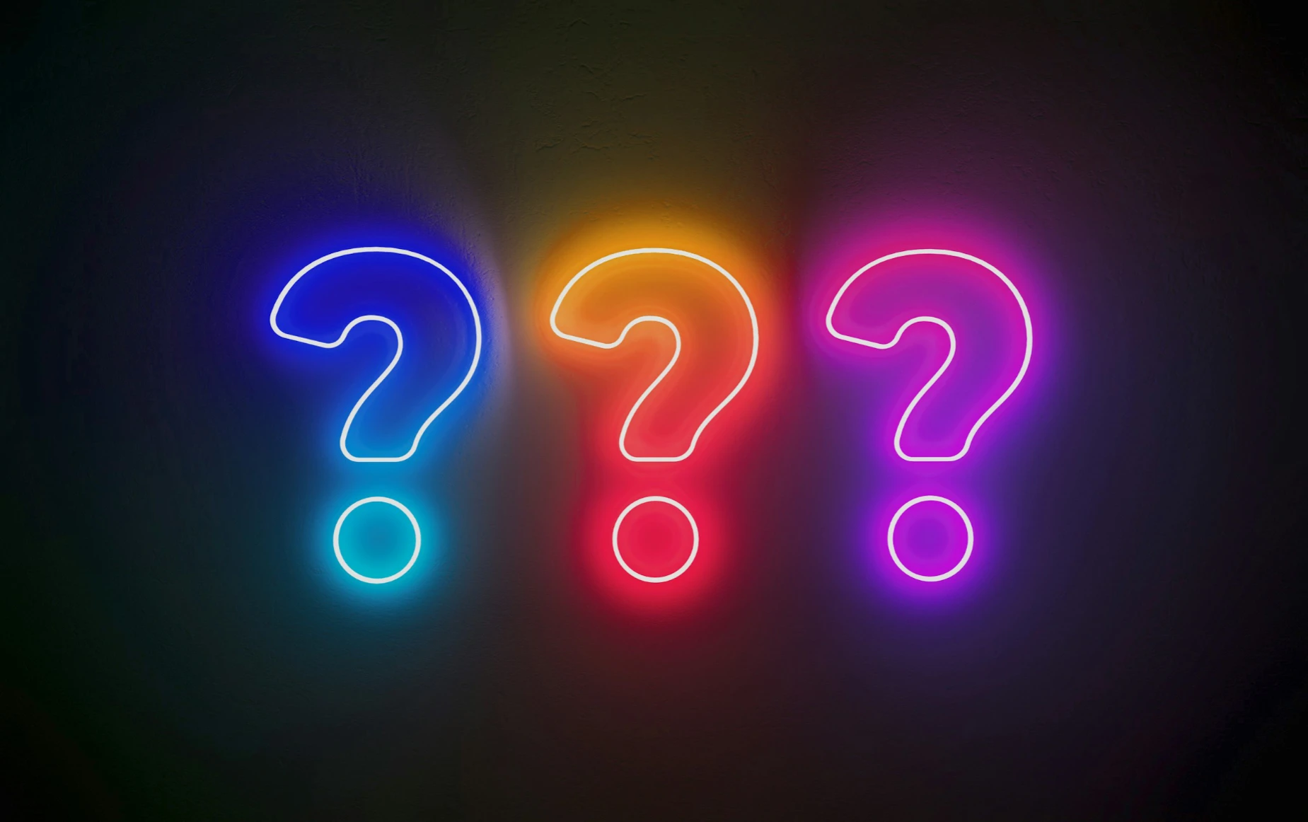 About us - Multi-coloured question marks