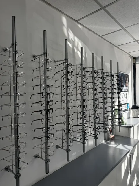 Spectacle frames displayed on the wall inside East Park Optical in Leicester.
